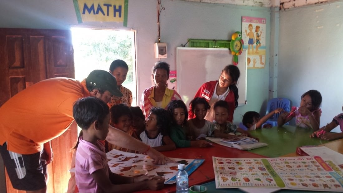 Our friend Raf Verelest engaging some kids at the Sala Monkey School.
