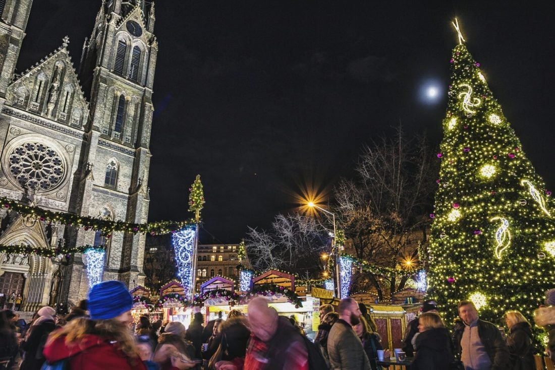 People standing near the Christmas tree in Namesti Miru, Prague
