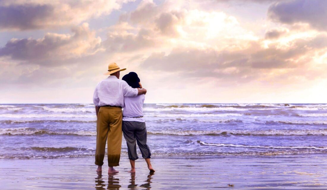 A couple standing on the beach at galveston beach