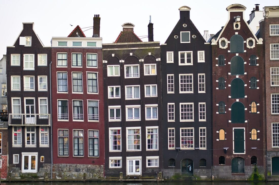 buildings standing side by side in Amsterdam