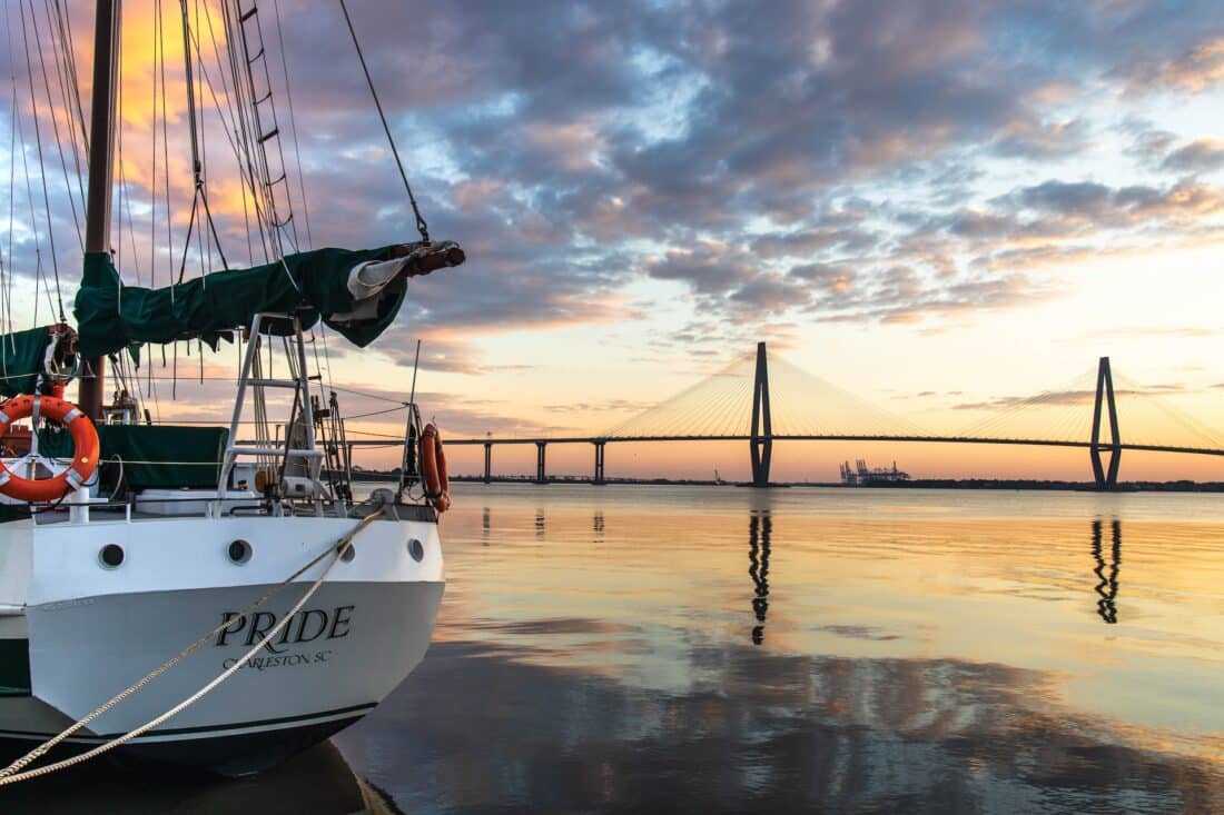 boat in harbor during sunset in charleston south carolina