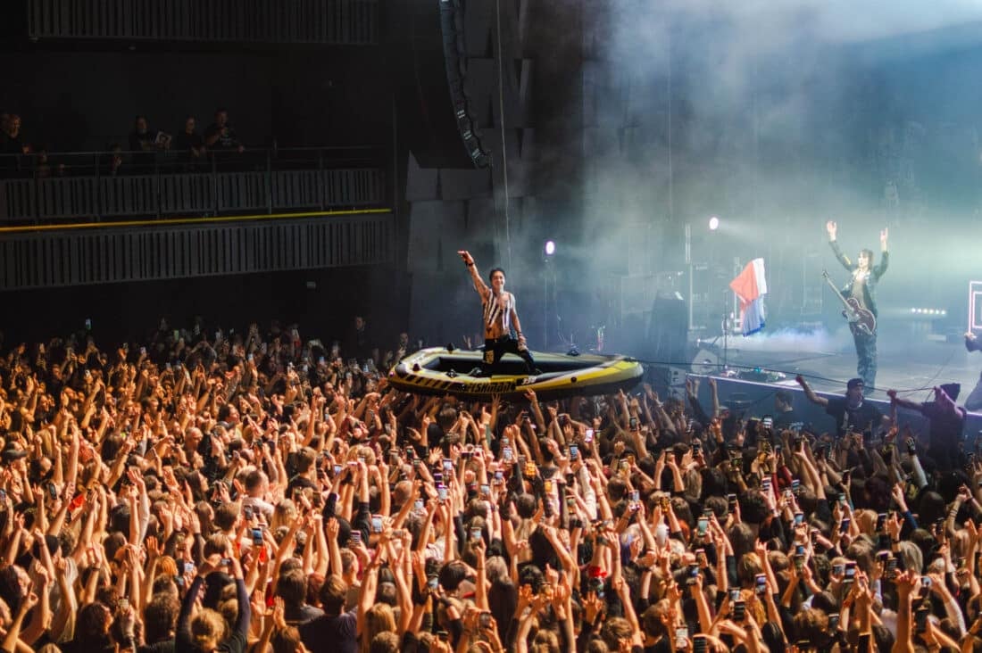 Palaye Royale's vocalist crowdsurfing on an inflatable boat at Forum Karlín.
