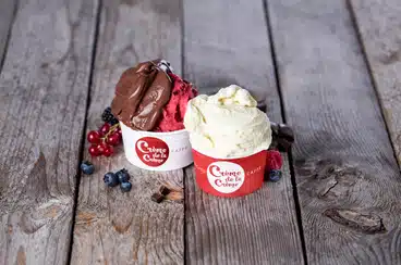 Two cups of ice cream from Crème de la Crème, one of the best Prague alternatives to Dairy Queen.